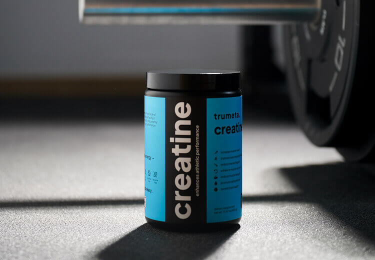 Creatine jar near barbell