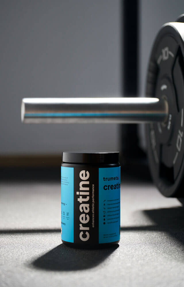 Creatine jar near barbell